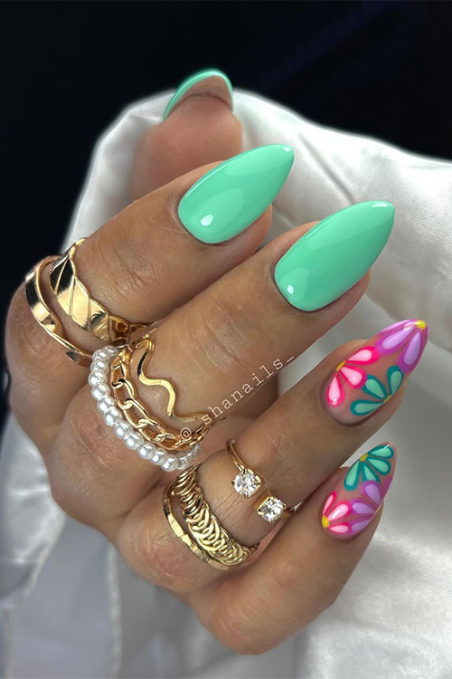 Cute pastel green nails with flowers on two accent nude nails