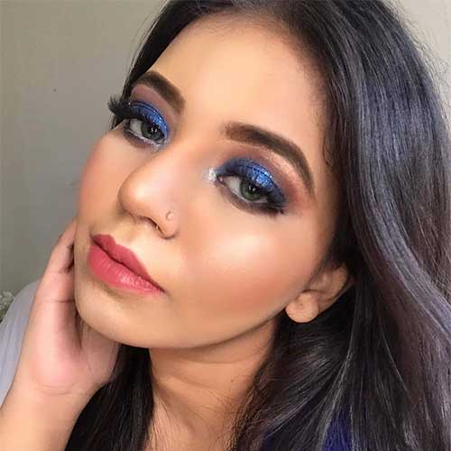 Electric blue smoky eyes with glitter