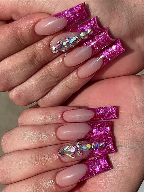 Long square shaped petal pink glitter French tip nails with rhinestones