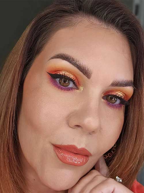 Neon makeup glitter using neon orange eyeshadow and neon purple fuchsia