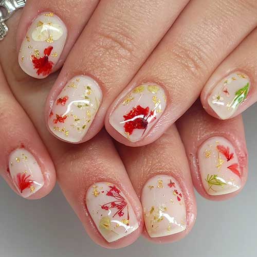 Stunning short pressed flower nails over white milky nail base color