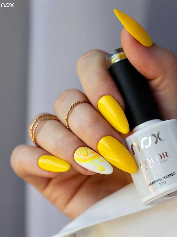 Long almond bright yellow summer nails with citrus nail art on an accent white nail