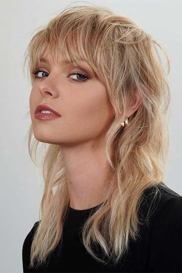 Long shaggy mullet with bangs is one of the best shag hairstyles for 2023