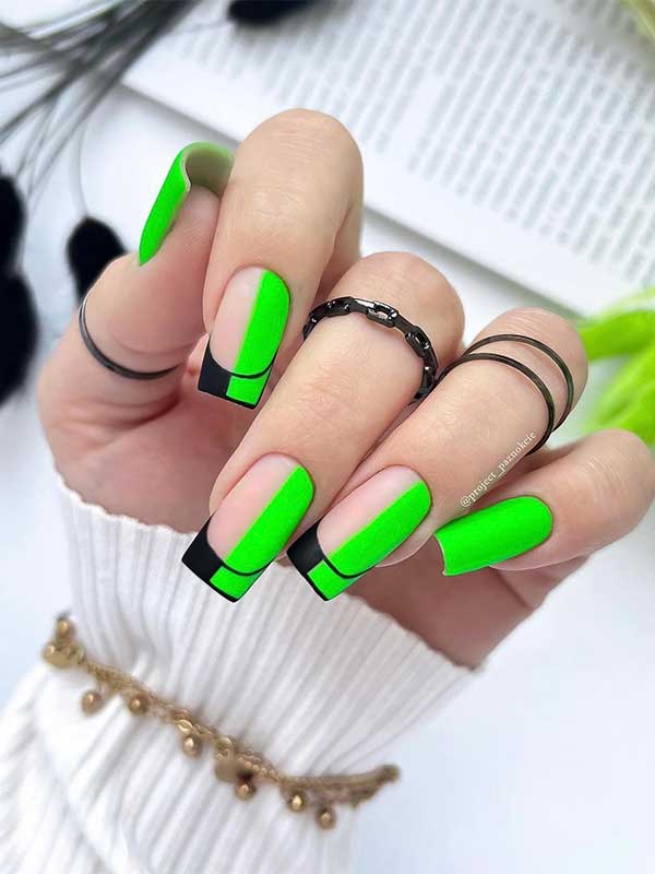 Medium square neon green nails with black nails adorned with twisted French tips