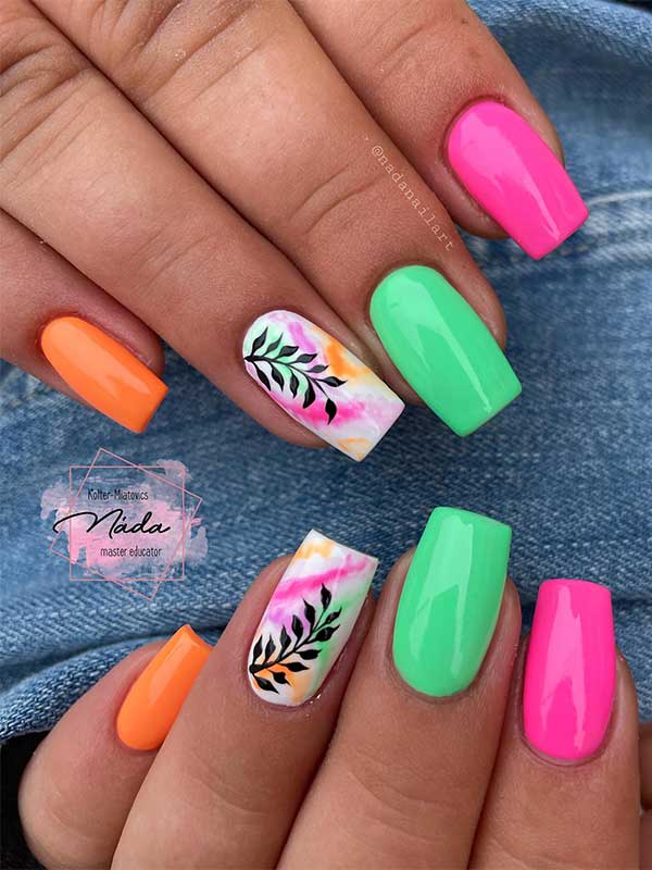 Short square pink green orange neon summer nails with leaf nail art on an accent white nail