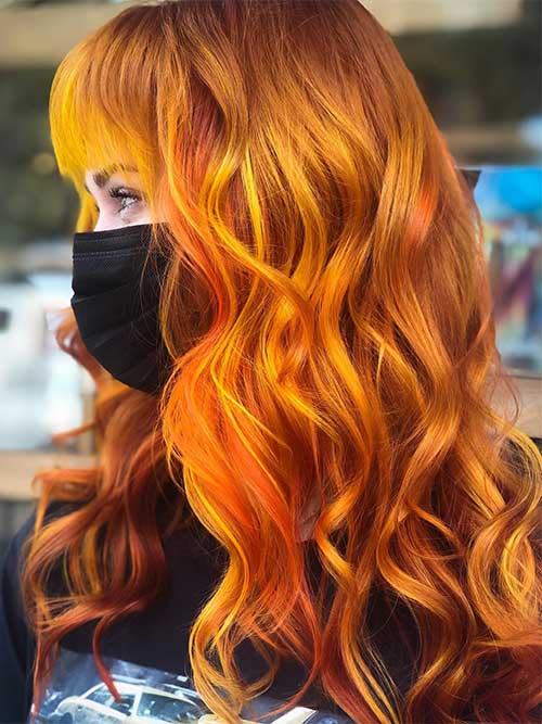 Long wavy hair dyed in Pumpkin Spice hair color