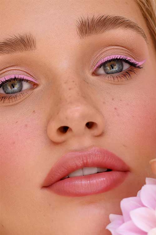 Pink eyeliner is a fun and playful colored eyeliner style that adds a pop of color to your eyes