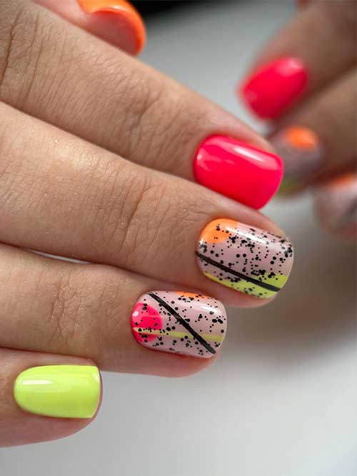 Red yellow orange neon nails with geometric nail art on two accent nails adorned with black speckles
