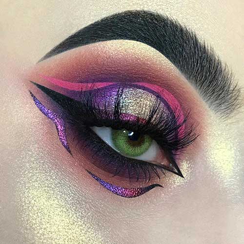 Shimmery eyeshadow look with pink, black, and purple graphic eyeliner style