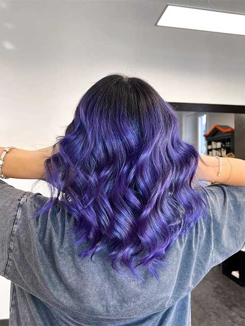 Wavy hair dyed in Midnight Violet hair color