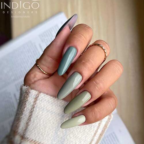 Long almond-shaped Soft green nails in different shades are perfect fall nails in 2023