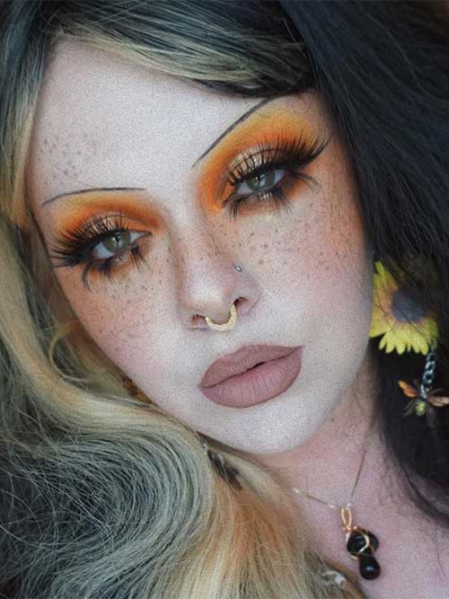 Orange and yellow makeup look with matte greige rose lips is one of the stylish fall makeup looks