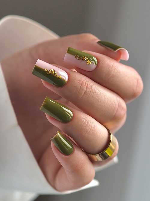 Square-shaped olive nails with two accent nails featuring half olive and half light pink designs, embellished with gold foil.