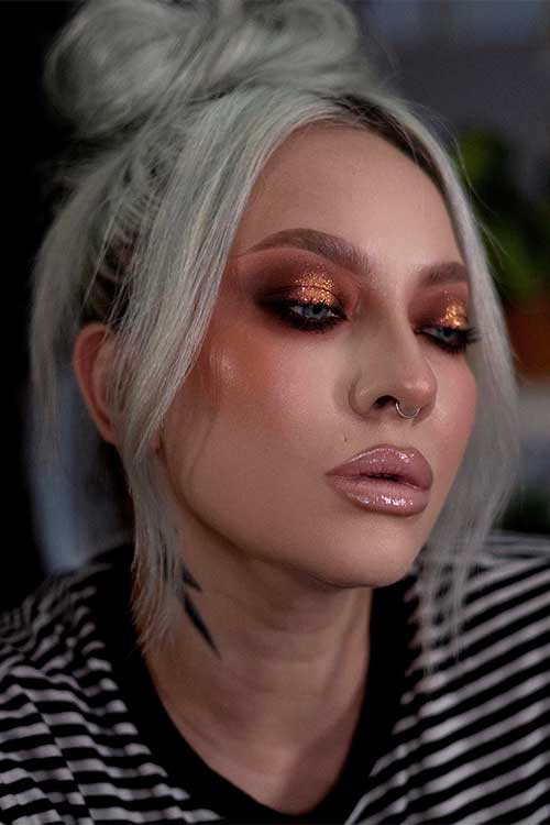 Stunning bronze and gold makeup look with glossy nude lips