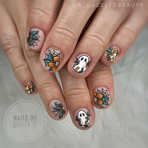 Short Halloween nails with orange, yellow, and brown flowers, cobwebs, and ghosts on a nude base color.