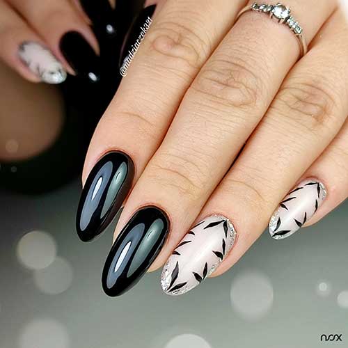 Long autumn black nails with a glossy finish, paired with matte nude nails featuring black leaves and silver foil