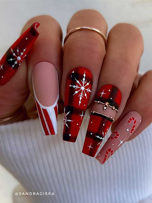 Long coffin-shaped matte buffalo plaid Christmas nails with white snowflakes gold rhinestones, and a candy cane French tip