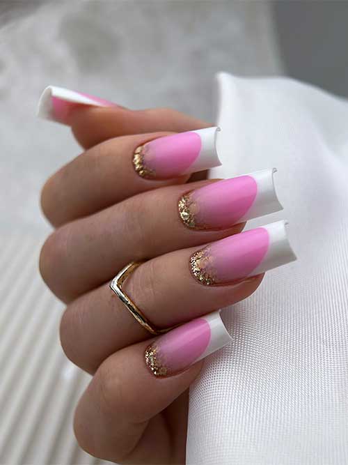Candy pink nails with white French tips and gold glitter on the cuticle area.