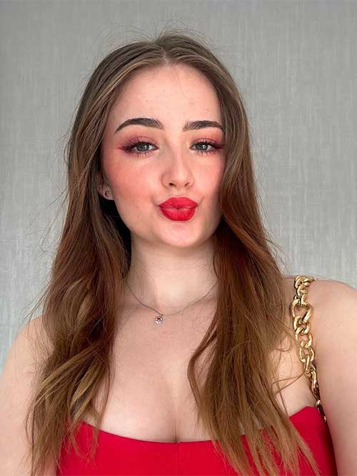 Simple matte Valentine’s makeup look using nude eyeshadow, red lips, and red simple winged eyeliner look