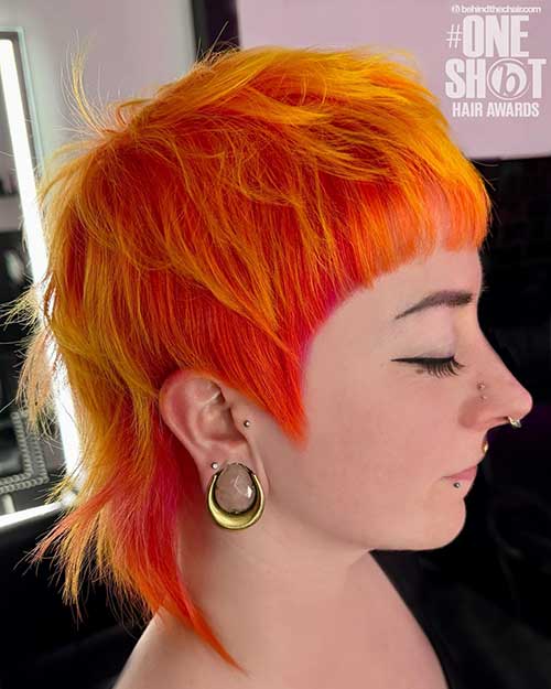 Stunning neon shag mullet haircut features neon orange hair with yellow highlights is one of the modern short shag haircuts