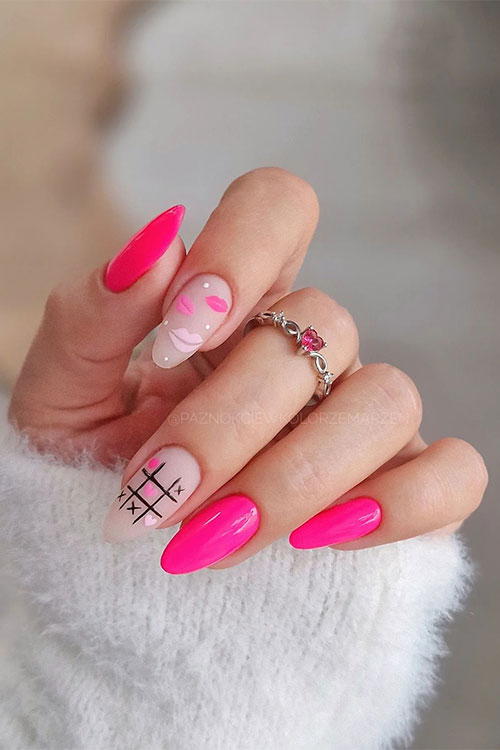 Glossy pink nails with two accent matte nude nails adorned with XO and lip nail art designs