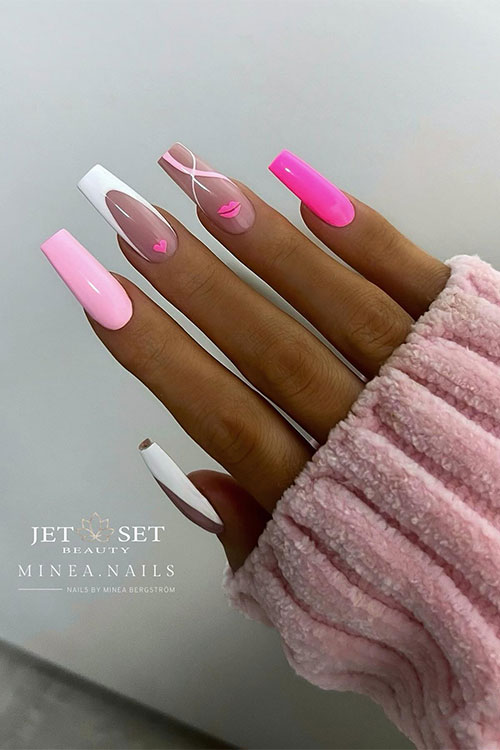 Pink and white Valentine’s Day nails feature a hot pink nail, a light pink nail, a nude nail with a pink lip, and swirls