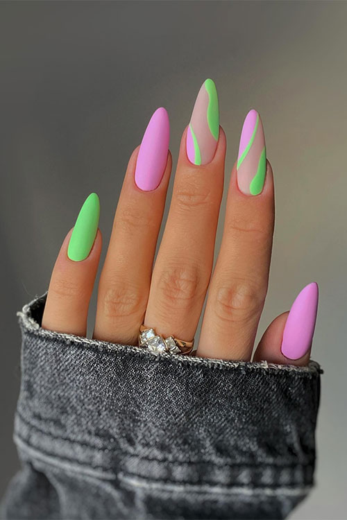 Stunning matte pink and green spring nails with two accent abstract nails over a nude base color