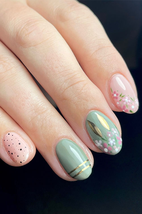 Short nude and sage green Easter nail design features floral nail art, gold chrome bunny ears, and black speckles