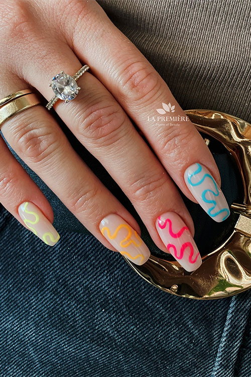 Long coffin milky white nails with multicolored swirls