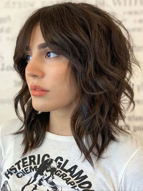 Medium wavy shag with curtain bangs