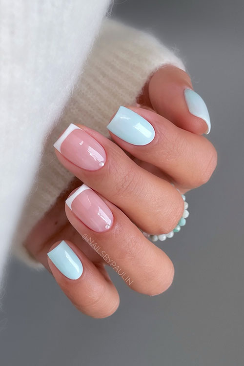 Short sky blue pastel nails with two accent classic white French tips