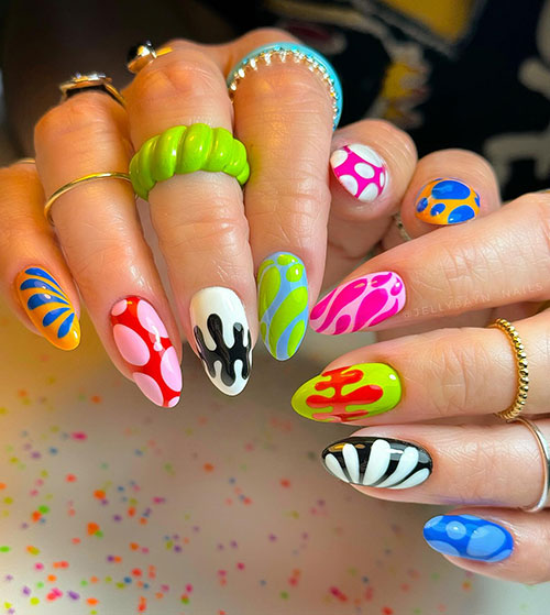 Almond-shaped bright funky neon nails feature colorful and vibrant abstract nail designs