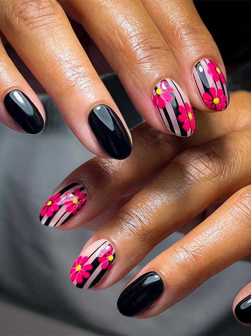 Glossy short black nails with two nude accent nails decorated with black line nail art and red flowers