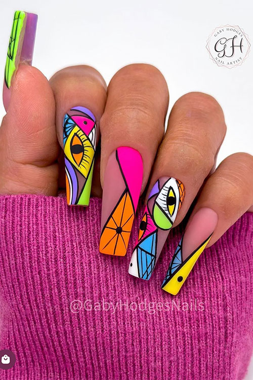 Long coffin-shaped matte geometrical multicolored neon nails decorated with eye nail art designs