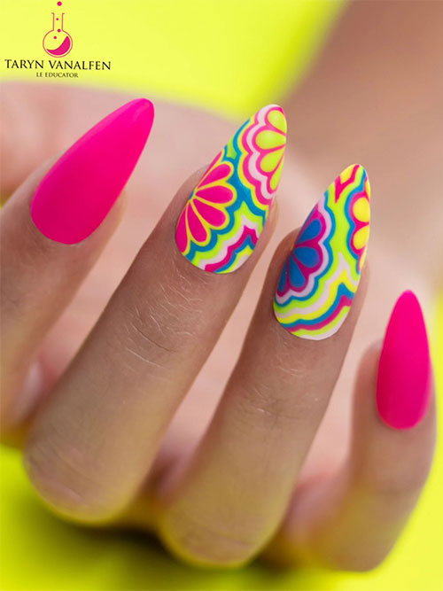 Long nude matte pink neon nails with two accent floral nails mixed with multicolored abstract nail art designs