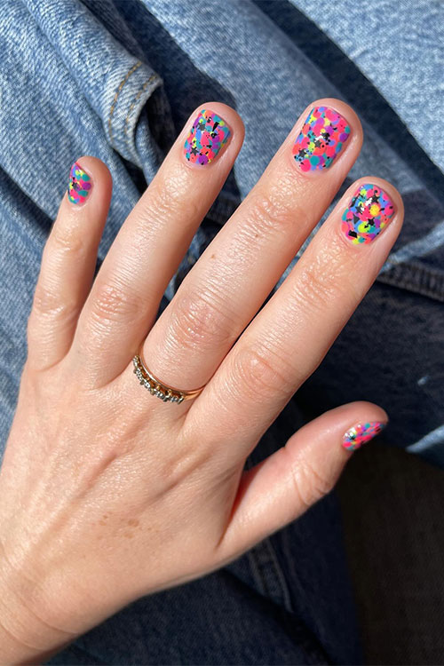 Short multicolored neon nails that feature dots on all the neon shades