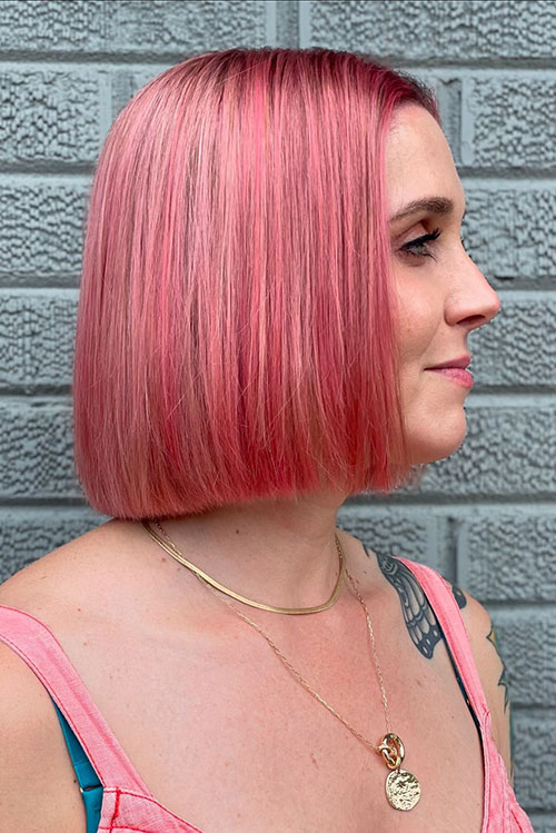 Short pink bob hair that is one of the summer hair colors in 2024