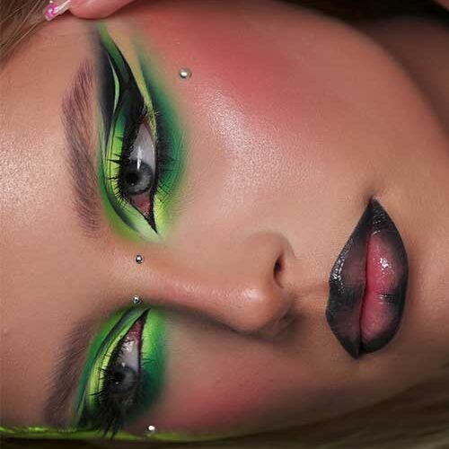 Stunning light and dark green eyeshadow with dark lip makeup look