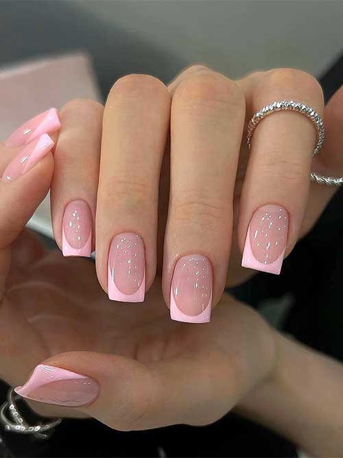 Chic short square press-on nails adorned with a pink French tip, offering a trendy and refined appearance.