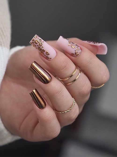 Copper chrome nails with leopard prints on three nude pink nails are one of the cute fall nail ideas