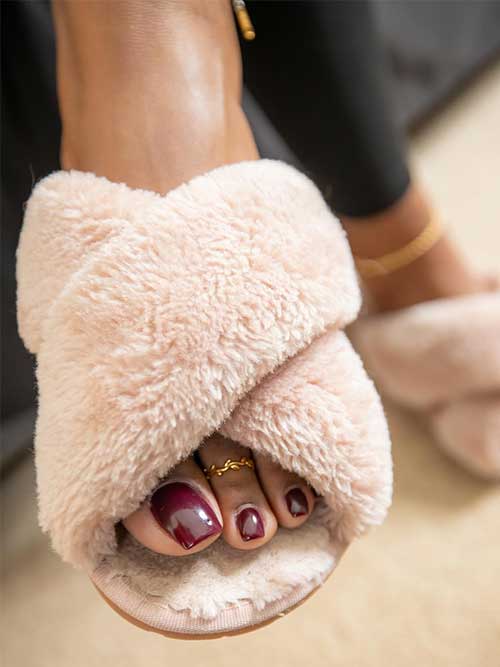 Reddish brown pedicure toenails perfectly complement the autumn season