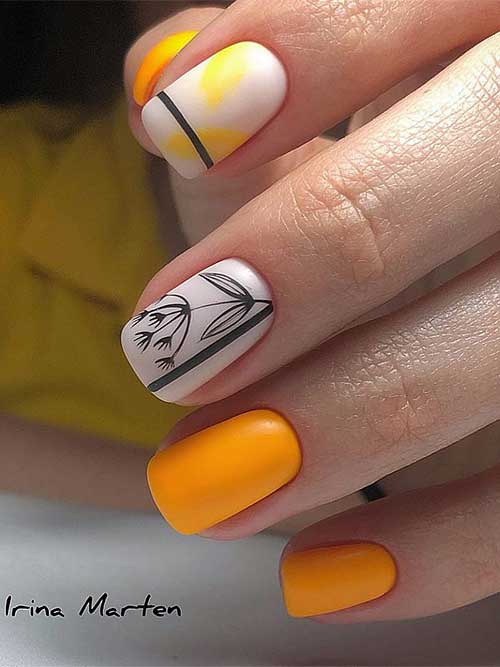 Short orange fall nails with two accent milky white nails decorated with black leaf nail art and line nail art designs