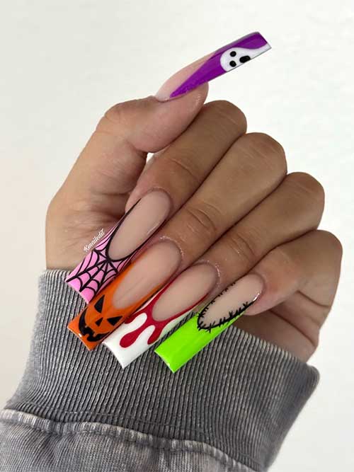 Cute multicolored French tip nails decorated with Halloween themes.