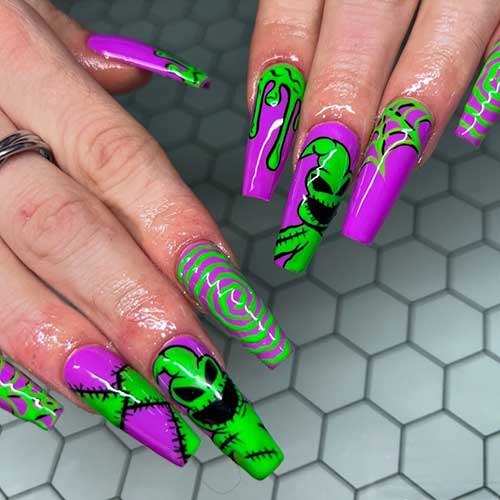 Long coffin-shaped Oogie boogie Halloween nails with purple base color.