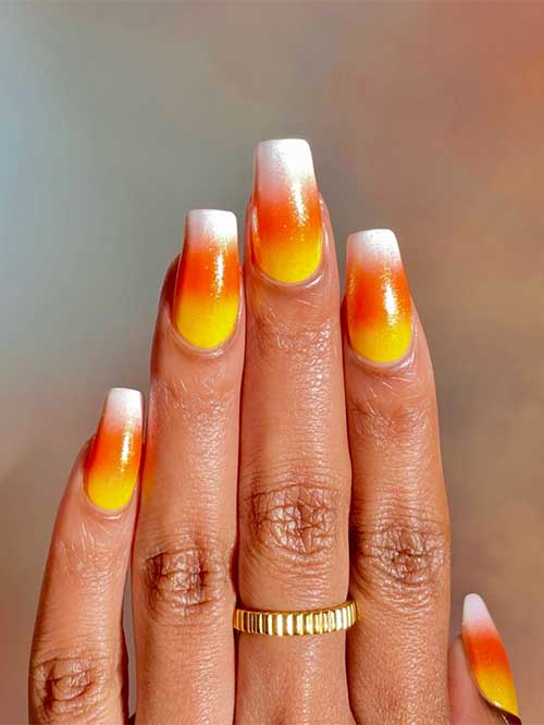 Long coffin-shaped candy corn Gradient cute Halloween nails.