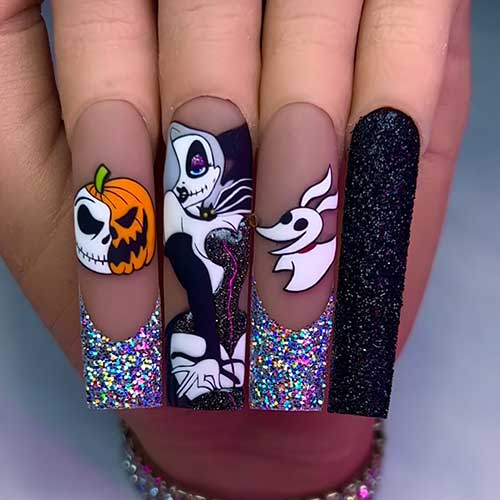 Long sparkly cute Halloween nails feature stitched Hollywood and pumpkin themes on two Holographic glitter French tips.