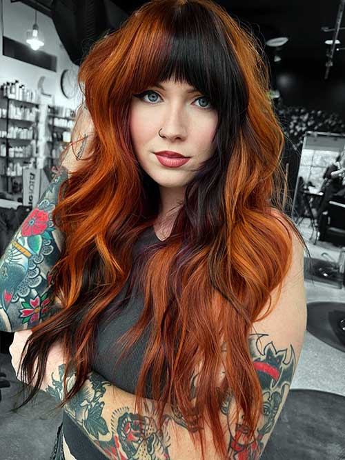 Warm color block dimensional long shag haircut with full bangs for winter.