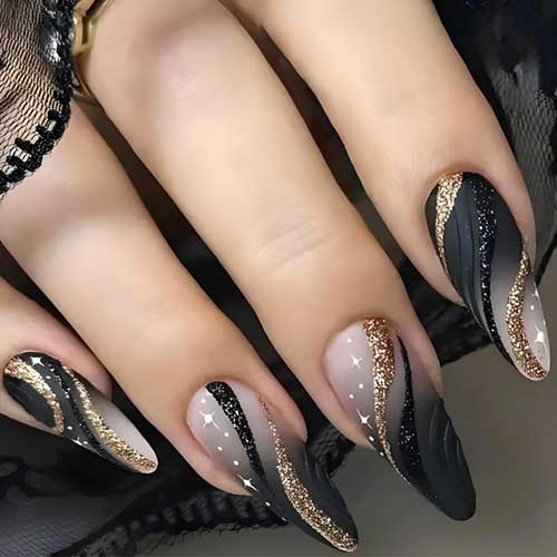 Black ombre press-on nails in medium almond shape featuring glittery black and gold swirls, perfect for New Year's Eve.