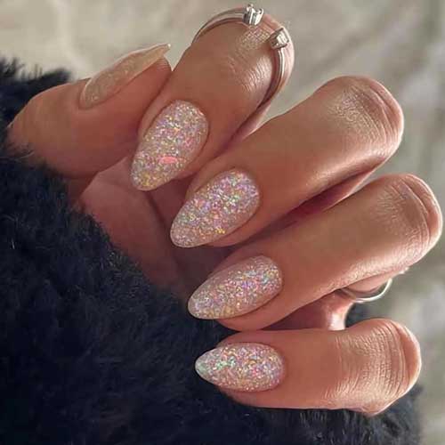 Glossy medium almond press-on nails with glitter and sequins, featuring 24 stylish acrylic designs for a sparkling look.