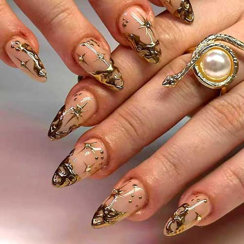 Short almond-shaped press-on nails with gold French tips and 3D chrome design, featuring glossy finish and full coverage.